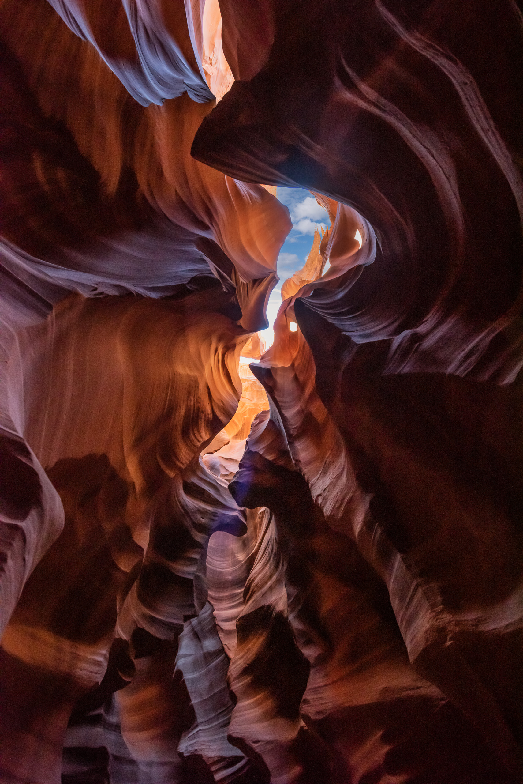 Vertical view inside Antelope Canyon in Arizona with flowing sandstone walls and light from above