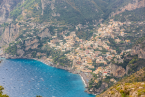 Panoramic photograph of Positano on the Amalfi Coast Italy with colorful hillside homes and blue sea