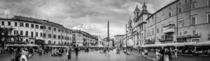 Black and white panoramic view of Piazza Navona in Rome Italy with historic buildings and central obelisk