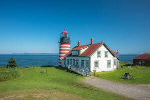West Quoddy Head Lighthouse overlooking the ocean in Maine