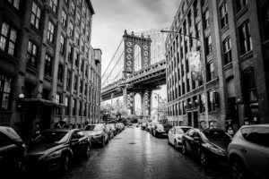 Manhattan Bridge viewed from DUMBO street in black and white horizontal scene in New York City