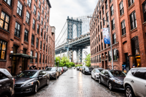 Manhattan Bridge viewed from DUMBO street with red brick buildings in New York City