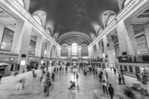 Grand Central Terminal main concourse in black and white with travelers in New York City