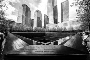 9/11 Memorial reflecting pool at Ground Zero in black and white, New York City