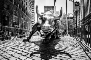 Charging Bull statue on Wall Street in black and white, New York City
