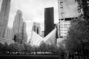 The Oculus at World Trade Center surrounded by Manhattan skyscrapers in black and white