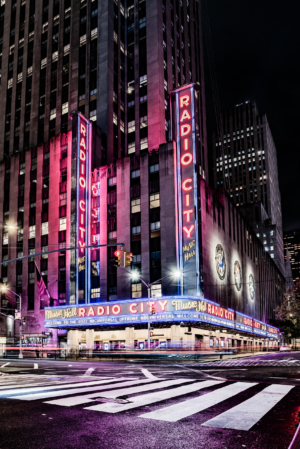 Radio City Music Hall neon marquee glowing at night in New York City