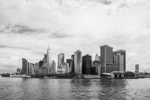 Black and white view of Lower Manhattan skyline across New York Harbor