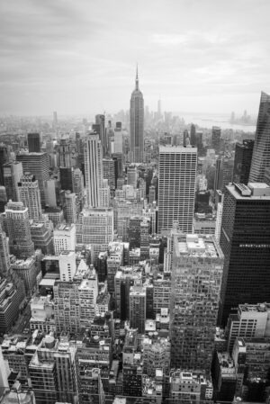 Black and white aerial view of Midtown Manhattan skyline with Empire State Building