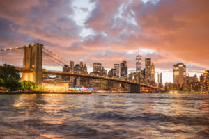Brooklyn Bridge and Manhattan skyline at sunset in New York City