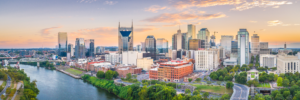 Nashville Tennessee skyline panorama at sunset with Cumberland River and downtown cityscape