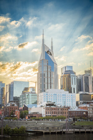 Nashville Tennessee skyline with dramatic sun rays breaking through clouds over downtown buildings