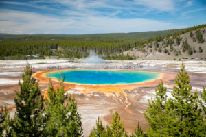 Grand Prismatic Spring in Yellowstone National Park with vivid blue water and orange geothermal colors