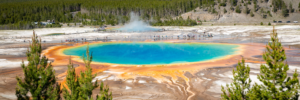 Panoramic view of Grand Prismatic Spring in Yellowstone National Park with vivid blue and orange colors