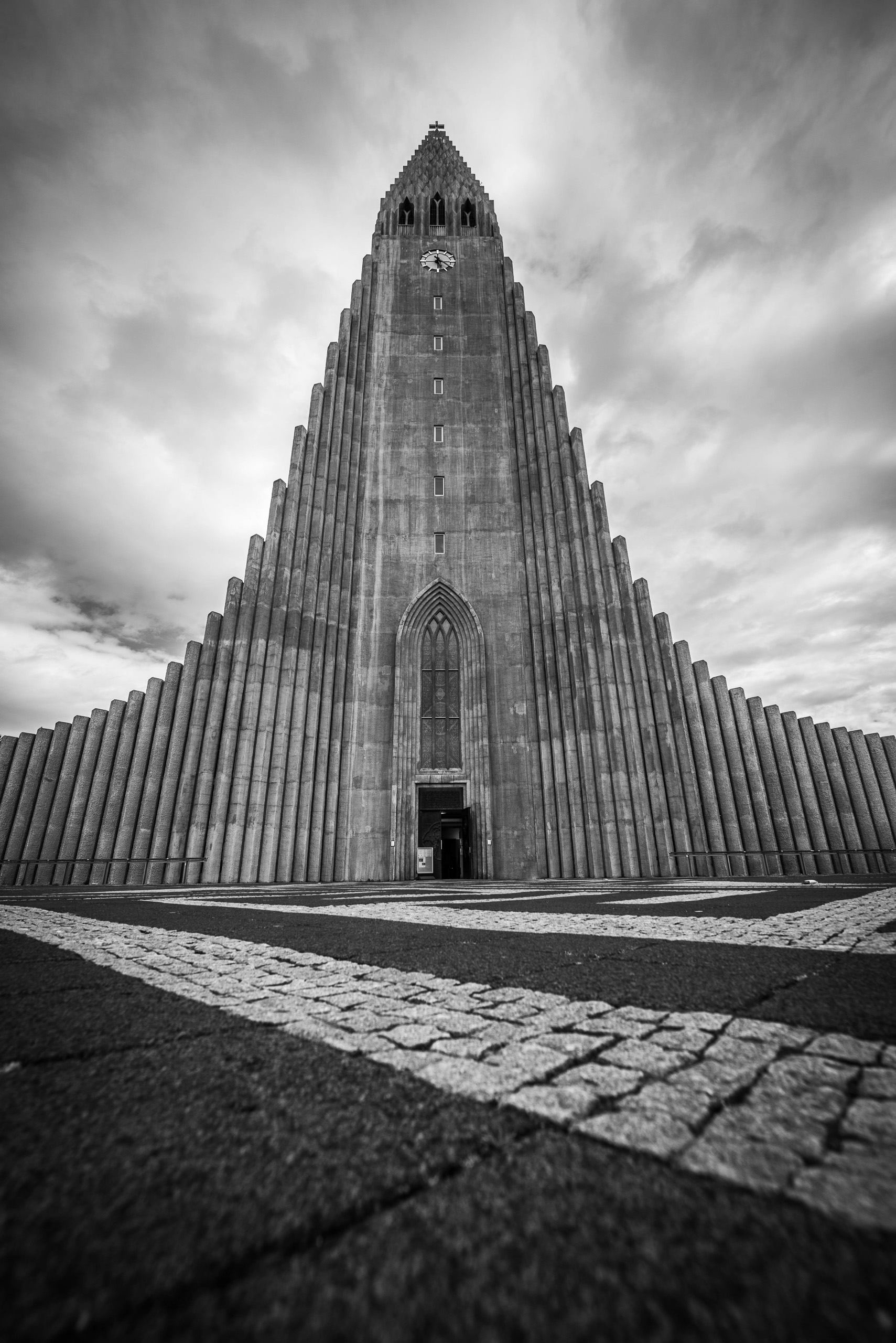 Black and white view of Hallgrimskirkja church in Reykjavik Iceland with dramatic clouds above