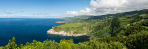Panoramic coastal view of green cliffs and blue ocean in the Azores Portugal