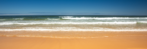 Waves rolling onto sandy beach along the west coast of Portugal