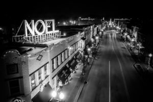 Black and white Noel sign overlooking downtown Franklin Tennessee at Christmas night