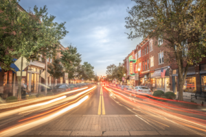 Light trails on Main Street in downtown Franklin Tennessee at dusk with historic storefronts