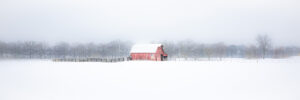 Red barn in snowy winter field near Franklin Tennessee panoramic landscape