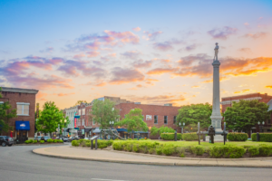 Historic downtown Franklin Tennessee town square at sunset with monument cannons and colorful sky
