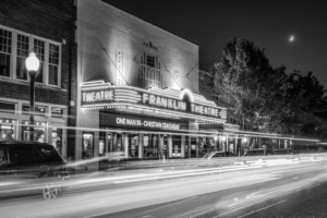 Black and white long exposure photograph of the historic Franklin Theatre at night in downtown Franklin, Tennessee