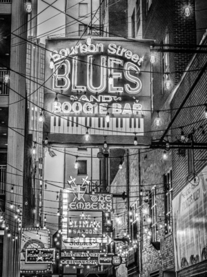 Black and white photograph of the neon signs and lights of Printers Alley in downtown Nashville, Tennessee
